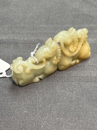 Three Chinese celadon and russet jade carvings of animals, 19th C.