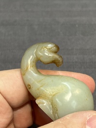 Three Chinese celadon and russet jade carvings of animals, 19th C.