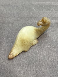 Three Chinese celadon and russet jade carvings of animals, 19th C.