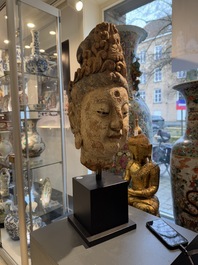 A large Chinese polychromed wooden head of Guanyin, probably Ming