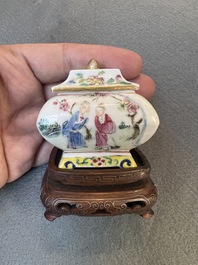 A fine Chinese famille rose covered water pot with figural design on wooden stand, 18th C.