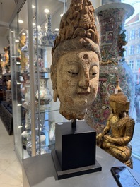 A large Chinese polychromed wooden head of Guanyin, probably Ming