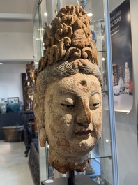 A large Chinese polychromed wooden head of Guanyin, probably Ming