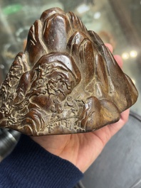 A Chinese agarwood carving of a mountain on wooden stand, 18/19th C.