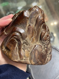 A Chinese agarwood carving of a mountain on wooden stand, 18/19th C.