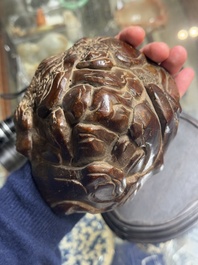 A Chinese agarwood carving of a mountain on wooden stand, 18/19th C.