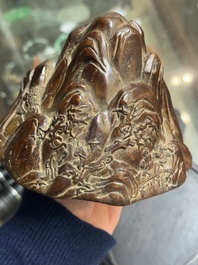 A Chinese agarwood carving of a mountain on wooden stand, 18/19th C.