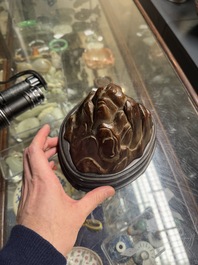 A Chinese agarwood carving of a mountain on wooden stand, 18/19th C.