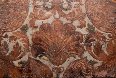 A gold leather fragment with floral design mounted on a wooden panel, Mechelen, 18th C.