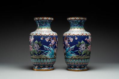 A pair of Chinese cloisonn&eacute; vases with birds among flowering branches, 20th C.