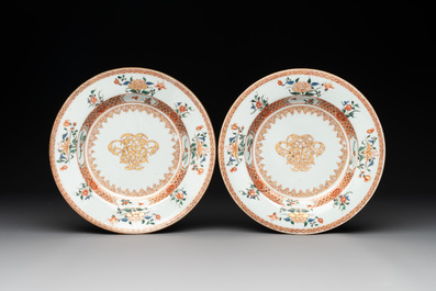 A pair of Chinese armorial monogrammed plates and a famille rose plate, Kangxi/Yongzheng