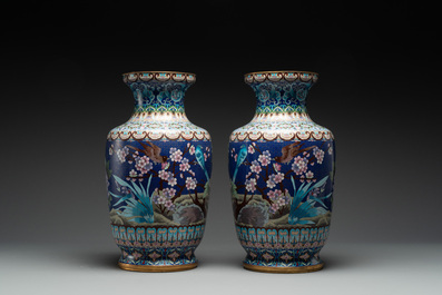 A pair of Chinese cloisonn&eacute; vases with birds among flowering branches, 20th C.
