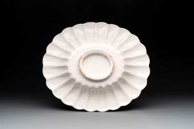 A rare gadrooned oval white Delftware dish, 17th C.