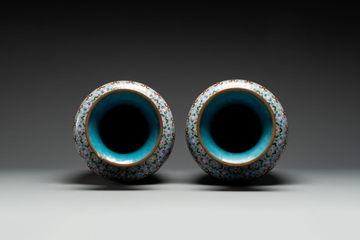 A pair of Chinese cloisonn&eacute; vases with birds among flowering branches, 20th C.