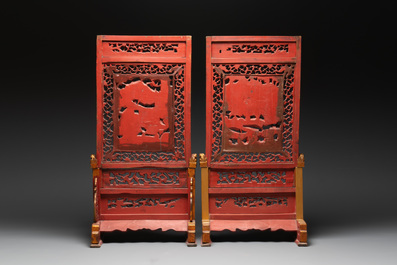 A pair of Chinese gilt-lacquered openworked wooden table screens with warriors on horseback, 19th C.