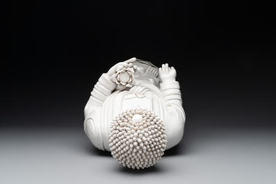 A large Chinese Dehua blanc de Chine figure of Buddha holding a lotus, He Chaozong 何朝宗 and Dehua 德化 mark, 20th C.