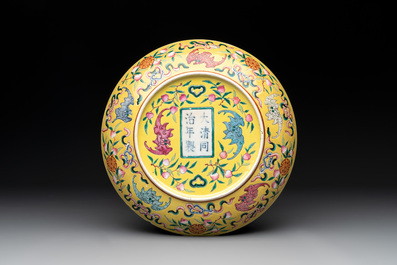 A Chinese famille rose yellow-ground 'bats and peaches' plate, Tongzhi mark and of the period