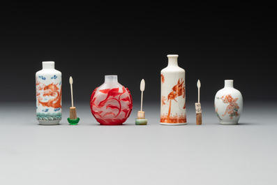 Three Chinese porcelain snuff bottles and a red Peking glass snuff bottle, Daoguang and Tongzhi mark, 19th C.