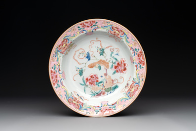 A pair of Chinese armorial monogrammed plates and a famille rose plate, Kangxi/Yongzheng