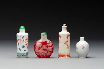 Three Chinese porcelain snuff bottles and a red Peking glass snuff bottle, Daoguang and Tongzhi mark, 19th C.