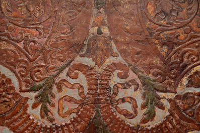 A gold leather fragment with floral design mounted on a wooden panel, Mechelen, 18th C.