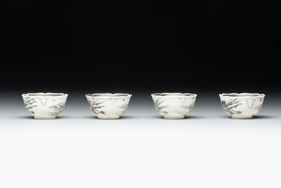 A set of four Chinese gilt-decorated grisaille 'landscape' cups and saucers, Yongzheng/Qianlong