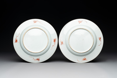 A pair of Chinese armorial monogrammed plates and a famille rose plate, Kangxi/Yongzheng