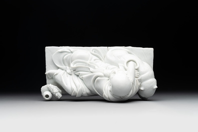 A Chinese Dehua blanc de Chine figure of a Luohan reclining on a tiger, Dehua and Bo Ji Yu Ren 博及漁人 mark, 20th C.