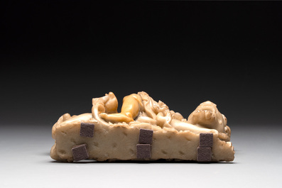 A Chinese carved group of a Luohan with two tigers, 20th C.