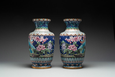 A pair of Chinese cloisonn&eacute; vases with birds among flowering branches, 20th C.