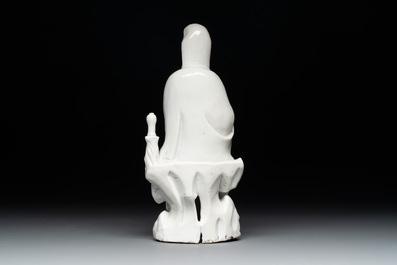 A Chinese Dehua blanc de Chine figure of Guanyin with a boy, Kangxi/Qianlong