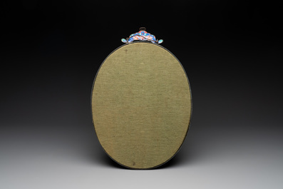 A large oval Chinese Canton enamel mirror, Qianlong