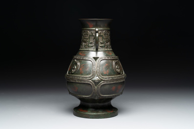 A Chinese archaistic gold- and silver-inlaid bronze vase with pseudo-rust patina, 19th C.