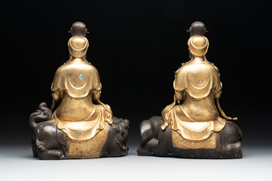 A Chinese parcel-gilt bronze Guanyin and a pair of Bodhisattvas, 20th C.