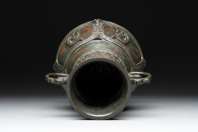 A Chinese archaistic gold- and silver-inlaid bronze vase with pseudo-rust patina, 19th C.