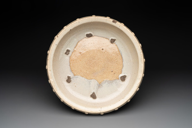 A large Chinese cream-glazed drum-shaped basin, Ming
