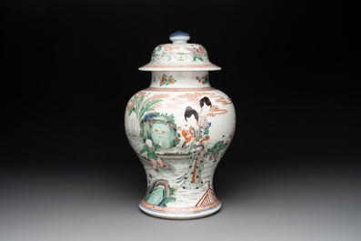 A Chinese famille verte 'ladies and boys' vase and cover, Kangxi