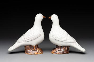 A pair of Chinese white-glazed Buddhist lions, a pair of doves and a pair of iron-red-decorated cranes, Ming and later