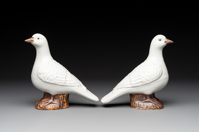 A pair of Chinese white-glazed Buddhist lions, a pair of doves and a pair of iron-red-decorated cranes, Ming and later