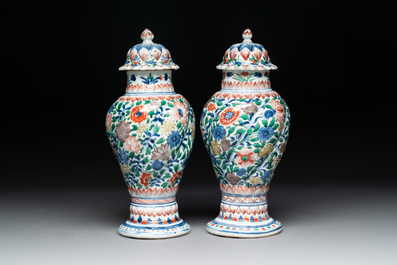 A pair of Chinese famille verte vases and covers with floral design, Kangxi