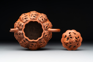 A Chinese Yixing stoneware reticulated double-walled teapot and a teapot with floral relief design, Kangxi