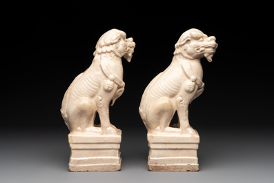 A pair of Chinese white-glazed Buddhist lions, a pair of doves and a pair of iron-red-decorated cranes, Ming and later