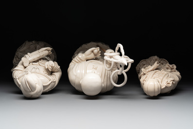 Three Chinese Dehua blanc de Chine figures of Guanyin and a monk, He Chaozong 何朝宗 and Dehua 德化 mark, 20th C.