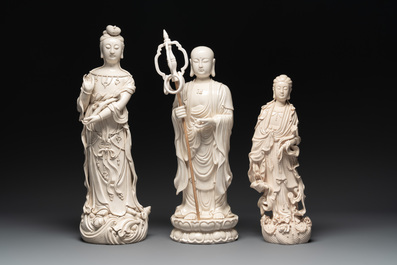 Three Chinese Dehua blanc de Chine figures of Guanyin and a monk, He Chaozong 何朝宗 and Dehua 德化 mark, 20th C.