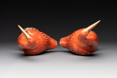 A pair of Chinese white-glazed Buddhist lions, a pair of doves and a pair of iron-red-decorated cranes, Ming and later