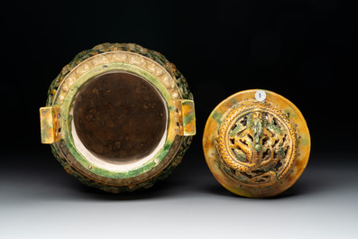 A Chinese sancai-glazed reticulated double-walled tripod censer and cover, Ming