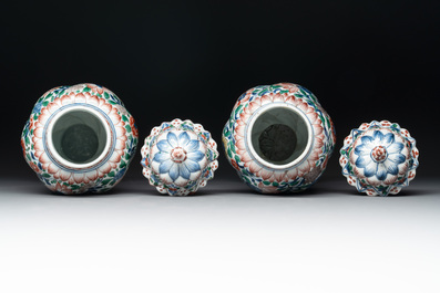 A pair of Chinese famille verte vases and covers with floral design, Kangxi