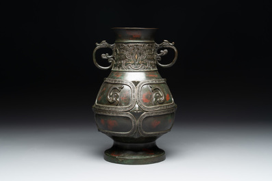 A Chinese archaistic gold- and silver-inlaid bronze vase with pseudo-rust patina, 19th C.