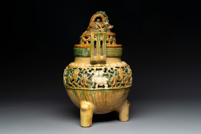 A Chinese sancai-glazed reticulated double-walled tripod censer and cover, Ming