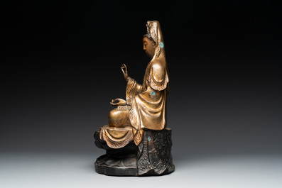 A Chinese parcel-gilt bronze Guanyin and a pair of Bodhisattvas, 20th C.